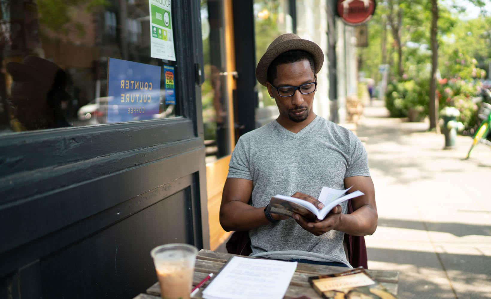 SPU student Chris Fuller studies outside a Ballard coffee shop - photo by Chris Yang